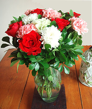 Strawberry Kisses - Premium red roses, mixed with red and white gerberra daisies, bright chrysanthemums and limoniums, swirling in greenery create a delightfully romantic gathering straight from the garden! *Vase not included. Every Flower Depot Bouquet is elegantly hand-wrapped in non-woven fabric with a paper twine ribbon. Includes: A greeting card with your personal message. Delivered with great care in our distinctive handmade boxes. The box includes care instructions.<br><br>Code:608-5923-608-0000107370